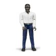 Figurka - Muž (tmavá pleť), tmavé kalhoty a bílá košile 60004 BRUDER